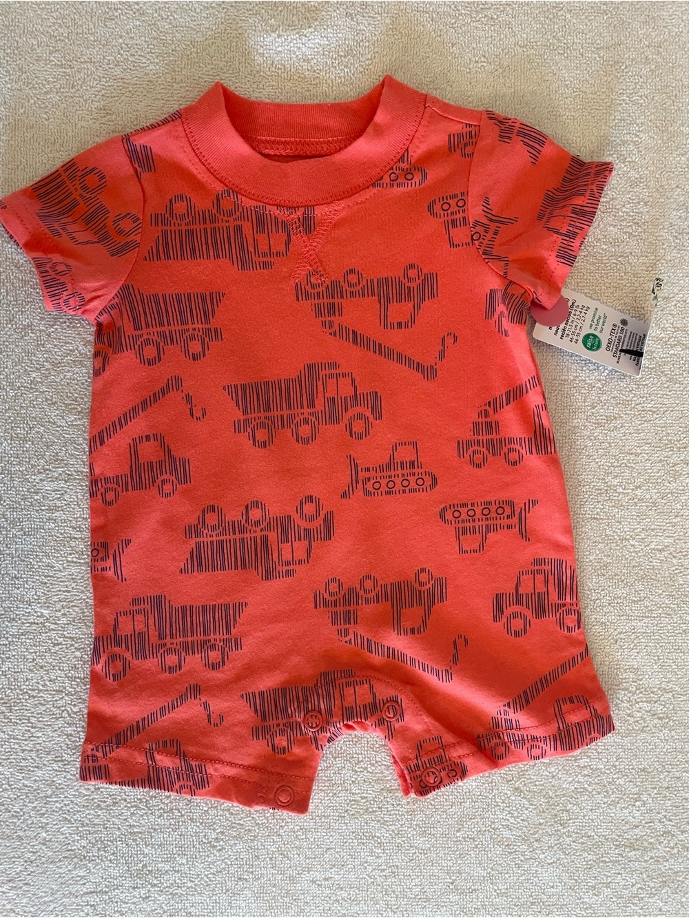 0NB Carter’s Orange Baby Romper with Navy Construction Motif